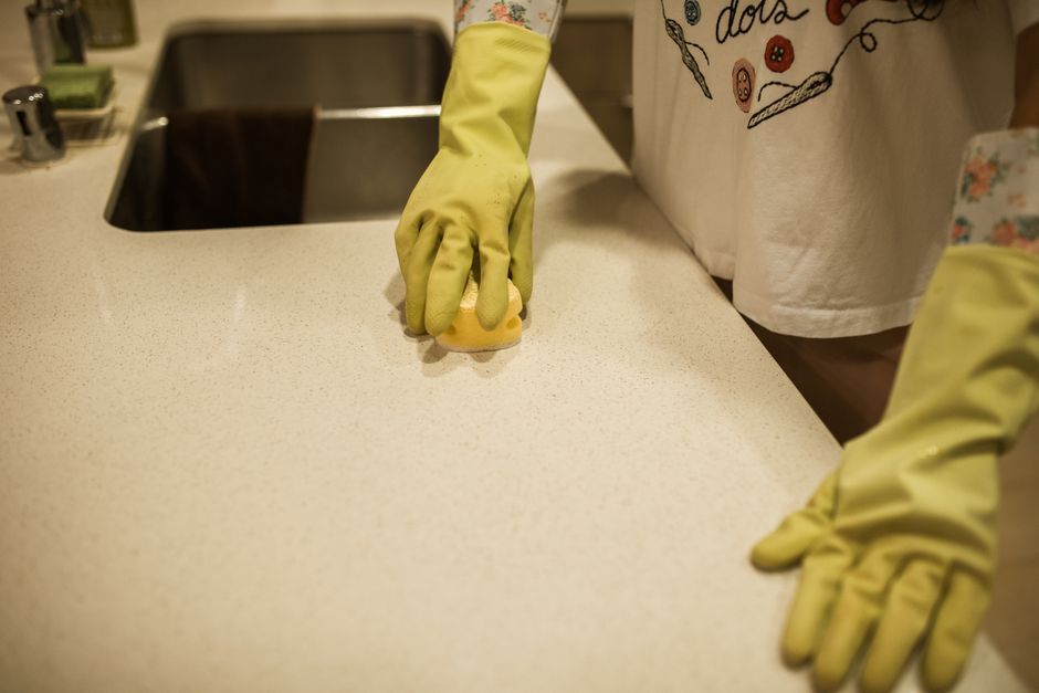 Professional cleaning a kitchen counter